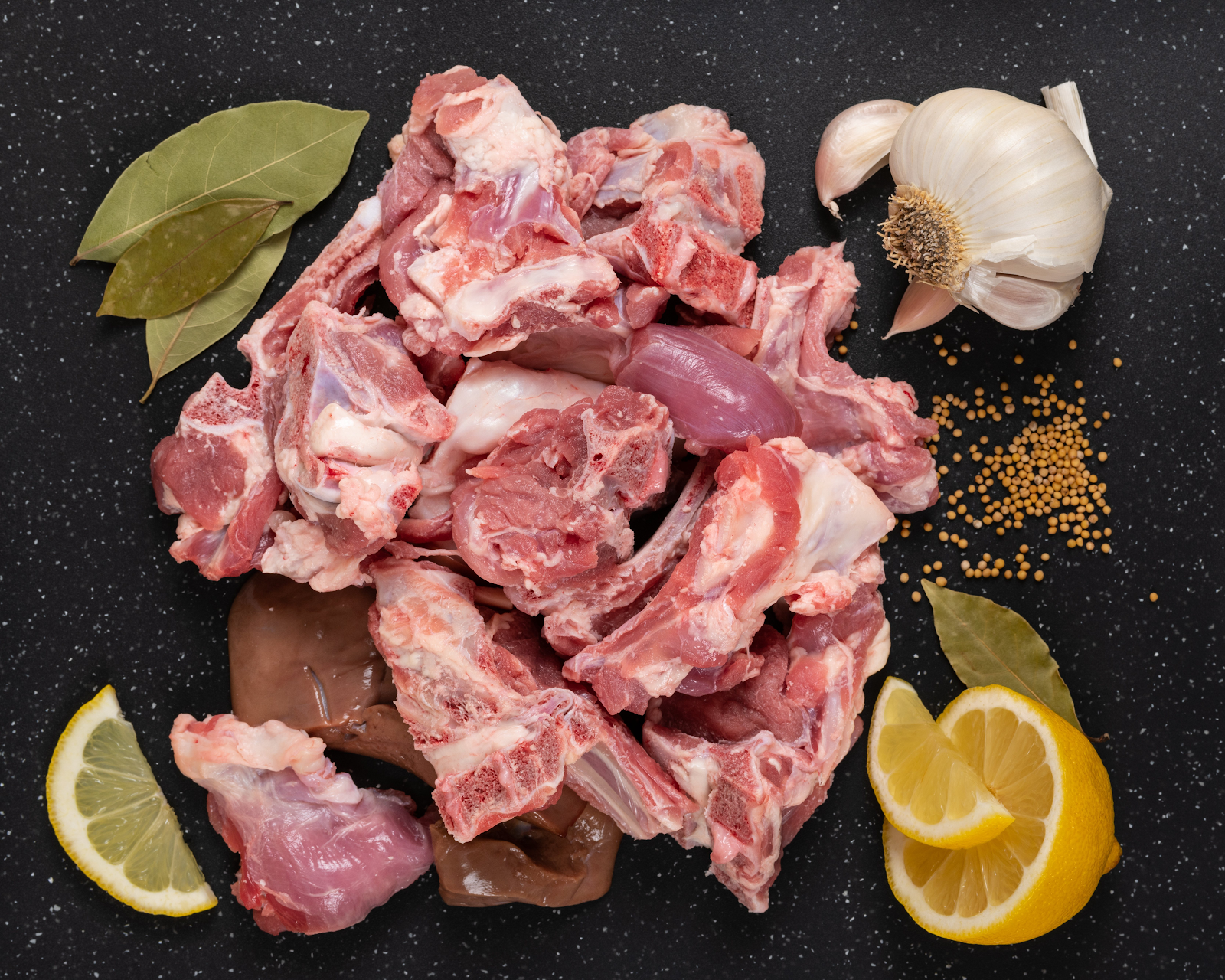 Fresh goat curry cut on dark background